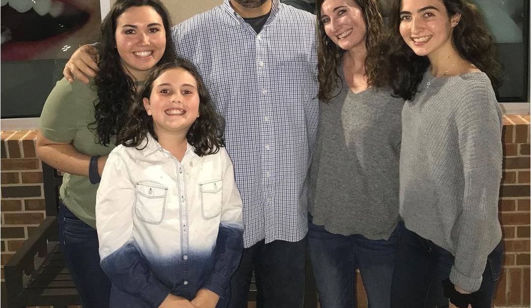 Mike Grodowsky, founder and owner of MCI Roofing, with his family
